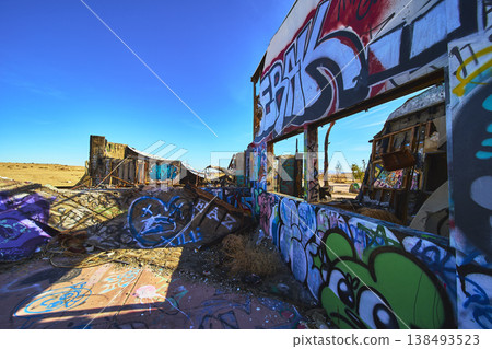 Abandoned Graffiti Covered Water Park Ruins and Desert Landscape California 138493523