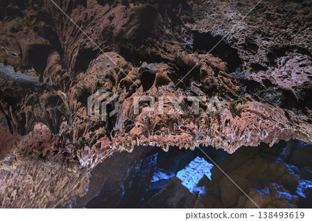 Lava Tube Ceiling Texture With Volcanic Rock And Blue Light In Mojave Desert 138493619