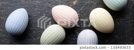 Pastel Easter eggs banner on dark rustic Pastel Easter eggs banner on dark rustic 138493633