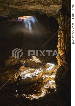 Cave Interior With Sunbeam Illuminating Rocks And Dramatic Shadows Cave Interior With Sunbeam Illuminating Rocks And Dramatic Shadows 138493701