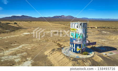 Aerial Abandoned Graffiti Water Tank in California Desert near Lake Dolores 138493716