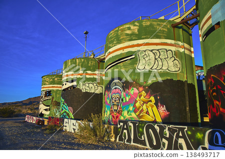 Graffiti Art on Abandoned Industrial Tanks in Desert at Goldome Mill California 138493717