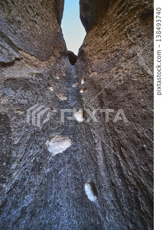 Rock Climbing Footholds Vertical Canyon Wall and Sky Perspective Rock Climbing Footholds Vertical Canyon Wall and Sky Perspective 138493740