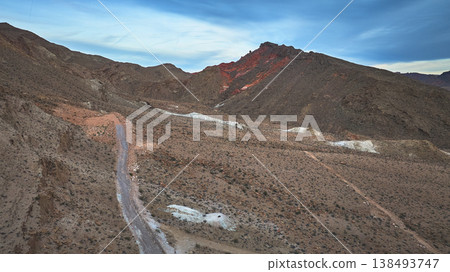 Aerial Nevada Desert Mountain Ridge and Winding Road Near Overton 138493747