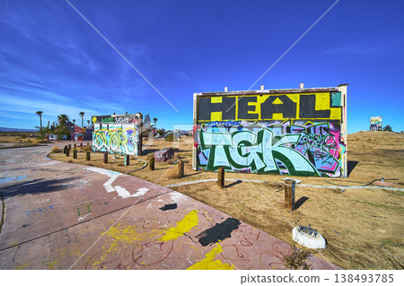 Graffiti Art and Abandoned Water Park Structures in Sunlit California Desert Graffiti Art and Abandoned Water Park Structures in Sunlit California Desert 138493785