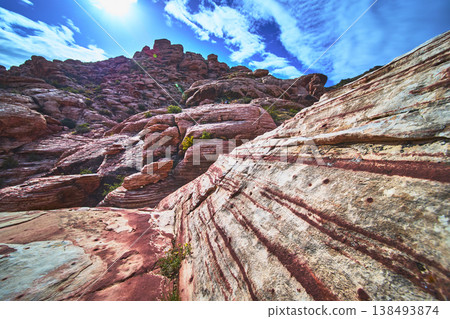 Red Rock Canyon Sandstone Striations and Kraft Mountain Under Vibrant Blue Sky 138493874