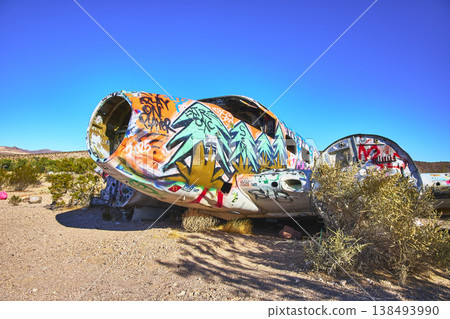 Graffiti Covered Abandoned Airplane Fuselage in Desert Near Beatty Nevada Graffiti Covered Abandoned Airplane Fuselage in Desert Near Beatty Nevada 138493990