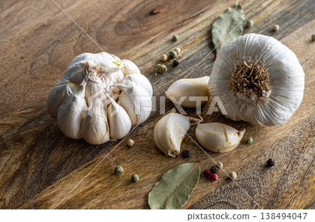 Fresh Garlic Heads on Wooden Board Fresh Garlic Heads on Wooden Board 138494047