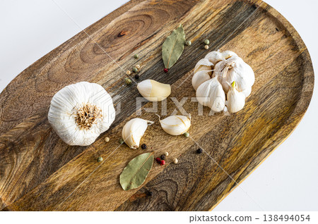 Organic Garlic Bulbs on Cutting Board 138494054