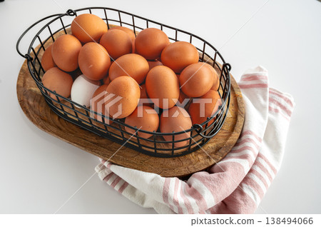 Organic Eggs in Wire Basket Indoors Organic Eggs in Wire Basket Indoors 138494066