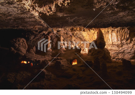 Cavern Stalagmites and Stalactites with Warm Light Painting in Cowboy Canyon 138494099