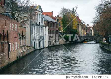 Bruges Canals Reflecting Historic Architecture at Sunset 138494187