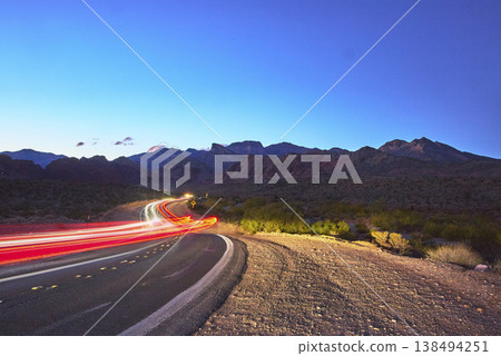 Red Rock Canyon Nevada Dusk Curving Road Car Light Trails Mountains 138494251