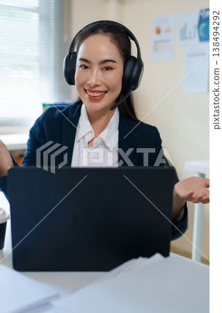 woman, call center agent or smile with voip for consulting, listening or contact us in office. Female consultant, customer service or tech support crm with headphones, microphone or help desk woman, call center agent or smile with voip for consulting, listening or contact us in office. Female consultant, customer service or tech support crm with headphones, microphone or help desk 138494292