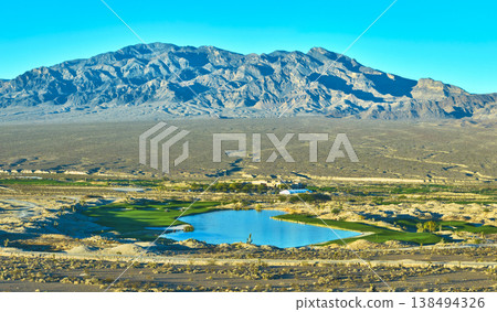 Aerial Golf Course Panorama with Mountain and Desert Landscape at Golden Hour Aerial Golf Course Panorama with Mountain and Desert Landscape at Golden Hour 138494326