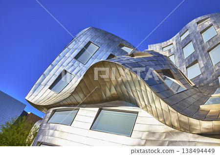 Modern Curved Metal Architecture in Las Vegas Nevada Under Clear Blue Sky 138494449