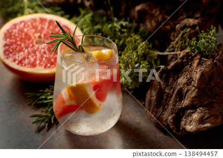 Refreshing hard seltzer with ice, grapefruit, and rosemary. Refreshing hard seltzer with ice, grapefruit, and rosemary. 138494457