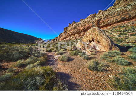 Red Rock Canyon Guardian Angel Trail Desert Landscape with Dramatic Boulder and Blue Sky 138494564