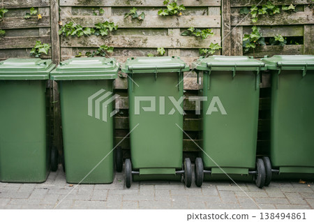 Colorful recycling bins on city street 138494861