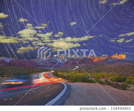 Star Trails Over Red Rock Canyon Night Road With Car Lights And Desert Landscape Star Trails Over Red Rock Canyon Night Road With Car Lights And Desert Landscape 138494903