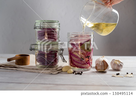 Homemade pickled red onions in jars, bright background Homemade pickled red onions in jars, bright background 138495114
