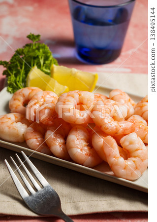Peeled shrimp on a plate, seafood, shrimp, protein food Peeled shrimp on a plate, seafood, shrimp, protein food 138495144