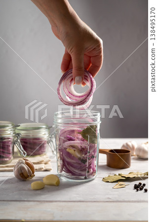 Homemade pickled red onions in jars, bright background 138495170