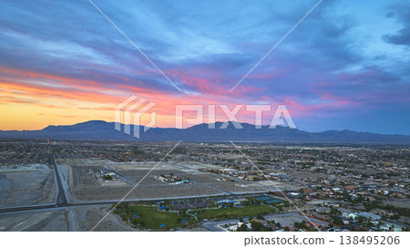 Aerial Las Vegas Urban Sprawl Desert Landscape and Mountain Range at Golden Hour 138495206