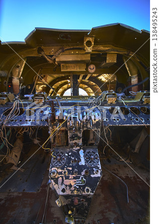 Abandoned Airplane Cockpit with Graffiti and Exposed Wiring in Desert Sunlight Abandoned Airplane Cockpit with Graffiti and Exposed Wiring in Desert Sunlight 138495243