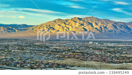 Aerial Las Vegas Suburban Neighborhoods and Sunlit Nevada Mountains Panorama Aerial Las Vegas Suburban Neighborhoods and Sunlit Nevada Mountains Panorama 138495249