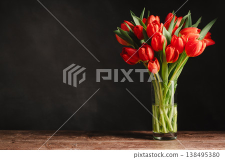 Spring flowers in a vase. A bouquet of fresh red tulips, birthday or easter background Spring flowers in a vase. A bouquet of fresh red tulips, birthday or easter background 138495380