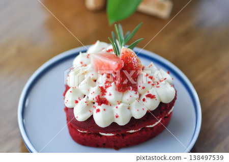 red velvet cake with strawberry topping or a piece of cake or small cake 138497539