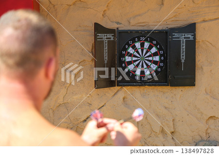 Egypt, Sharm el-Sheikh - September 30, 2025. Tourists spend their free time playing darts on the beach of the Savoy Hotel. Editorial 138497828