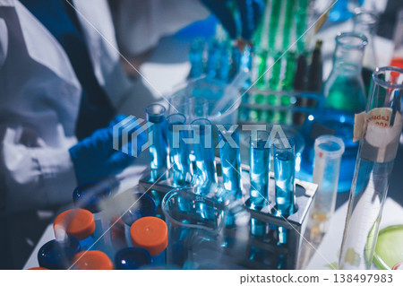Science, laboratory and woman with pipette, test tube and biotech solution in research. Medical innovation, scientist or lab technician in study for healthcare, medicine and vaccine results feedback. Science, laboratory and woman with pipette, test tube and biotech solution in research. Medical innovation, scientist or lab technician in study for healthcare, medicine and vaccine results feedback. 138497983