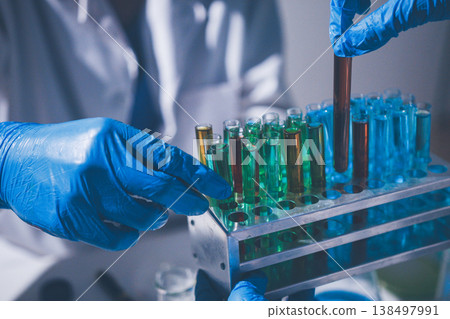 Science, laboratory and woman with pipette, test tube and biotech solution in research. Medical innovation, scientist or lab technician in study for healthcare, medicine and vaccine results feedback. Science, laboratory and woman with pipette, test tube and biotech solution in research. Medical innovation, scientist or lab technician in study for healthcare, medicine and vaccine results feedback. 138497991