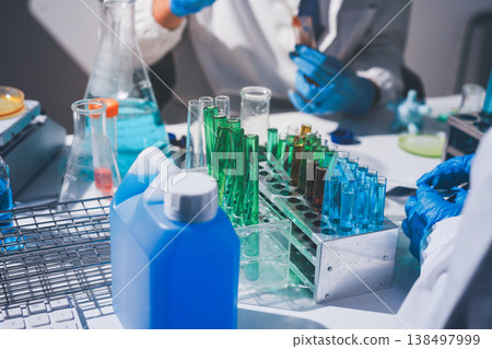 Science, laboratory and woman with pipette, test tube and biotech solution in research. Medical innovation, scientist or lab technician in study for healthcare, medicine and vaccine results feedback. Science, laboratory and woman with pipette, test tube and biotech solution in research. Medical innovation, scientist or lab technician in study for healthcare, medicine and vaccine results feedback. 138497999