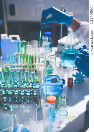 Science, laboratory and woman with pipette, test tube and biotech solution in research. Medical innovation, scientist or lab technician in study for healthcare, medicine and vaccine results feedback. Science, laboratory and woman with pipette, test tube and biotech solution in research. Medical innovation, scientist or lab technician in study for healthcare, medicine and vaccine results feedback. 138498004