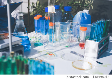 Science, laboratory and woman with pipette, test tube and biotech solution in research. Medical innovation, scientist or lab technician in study for healthcare, medicine and vaccine results feedback. 138498018