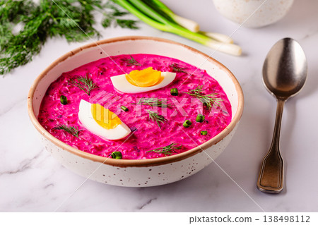 Cold summer soup of beets, yogurt, cucumbers, eggs and dill. 138498112