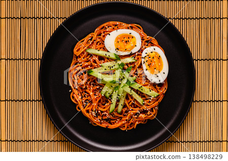 Korean traditional food, cucumber and boiled egg cold spicy noodles. 138498229