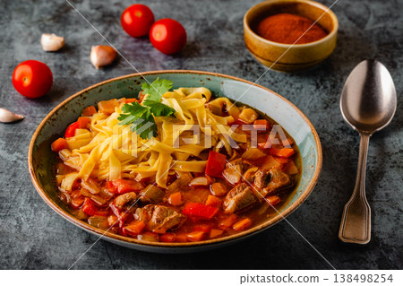 Lagman soup with lamb, homemade noodles and vegetables. 138498254