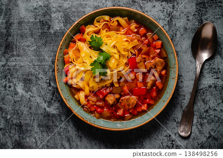Lagman soup with lamb, homemade noodles and vegetables. Lagman soup with lamb, homemade noodles and vegetables. 138498256