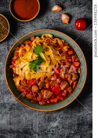 Lagman soup with lamb, homemade noodles and vegetables. Lagman soup with lamb, homemade noodles and vegetables. 138498259