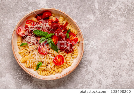Homemade pasta with tomato sauce, top view. 138498260