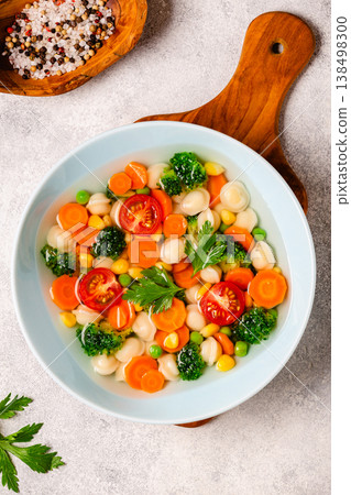 Soup with mini dumplings and vegetables. 138498300