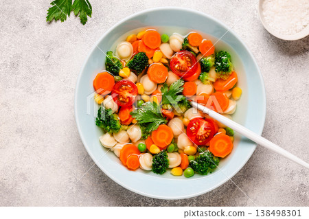 Soup with mini dumplings and vegetables. 138498301
