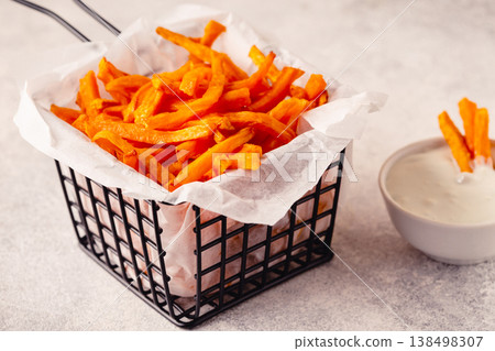 Sweet potato fries with blue cheese sauce. Sweet potato fries with blue cheese sauce. 138498307