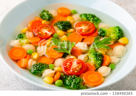 Soup with mini dumplings and vegetables. Soup with mini dumplings and vegetables. 138498365
