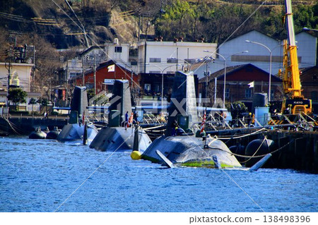 At the naval port of Kure... Submarines protect Japan from the sea. At the naval port of Kure... Submarines protect Japan from the sea. 138498396