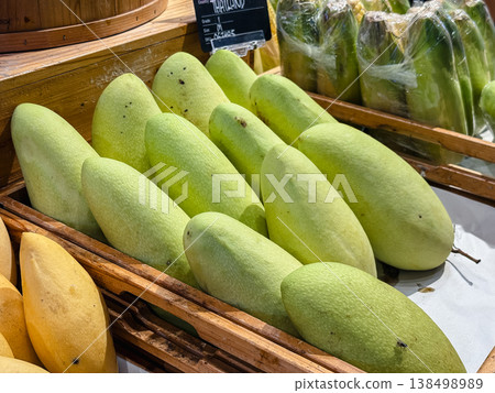 Mangoes lined up in the fruit section (display of tropical fruits) Mangoes lined up in the fruit section (display of tropical fruits) 138498989